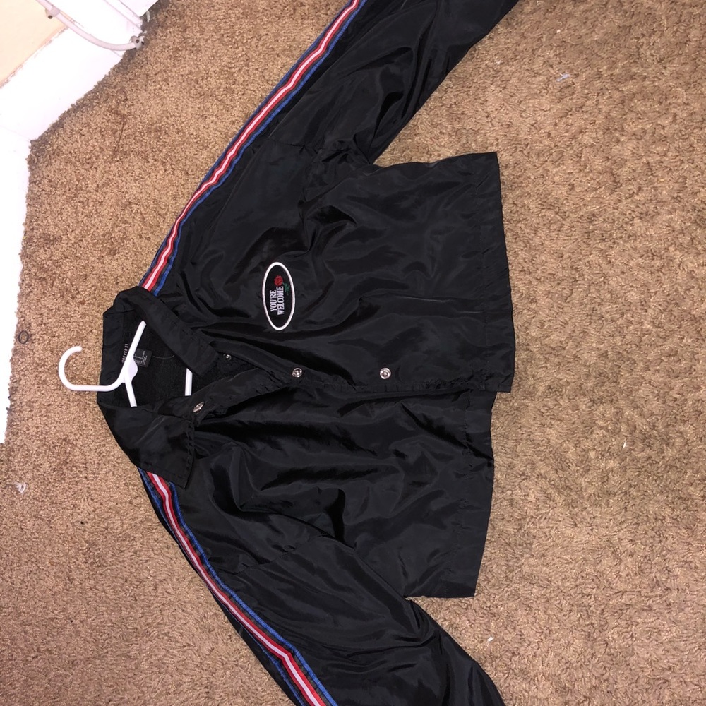black windbreaker with cute details